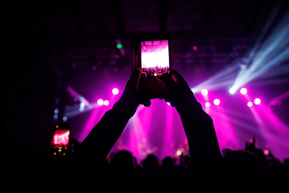 Video,Recording,Of,The,Concert,On,A,Mobile,Phone,Or